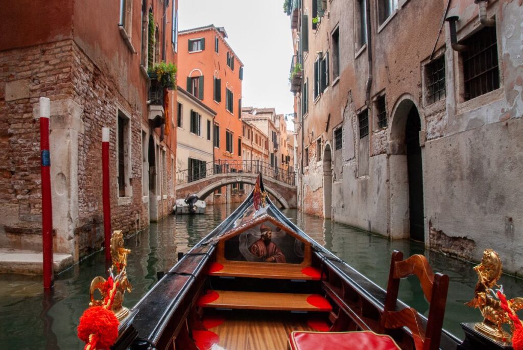 the view from a gondola on one of Venice's canals